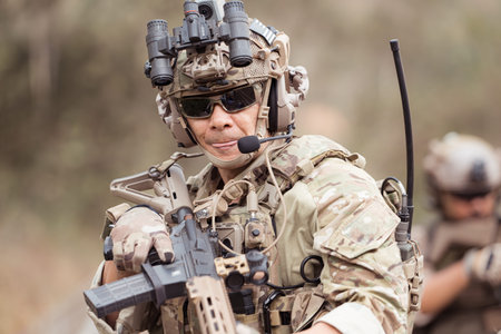 Soldiers in camouflage military uniforms carrying weapons, Reconnaissance missions in the tropical...