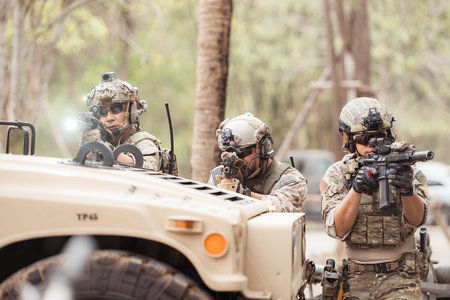 Soldiers in camouflage uniforms hold weapons ready to fire, By hiding on the side military...
