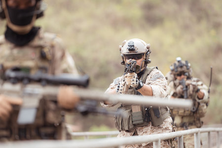 Soldiers in camouflage military uniforms carrying weapons, Reconnaissance missions in the tropical...