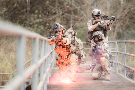 Soldiers in camouflage military uniforms carrying weapons, Reconnaissance missions in the tropical forest area, Assault infantry battle training.の写真素材