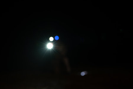 Soldiers in camouflage uniforms hold weapons with patrol missions at nightの写真素材