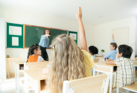 Teacher and students, Learn and study in a classroom of school where youngsters sit and listen attentively.の写真素材