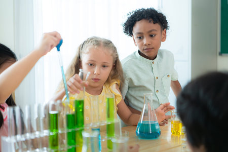 Teacher and students, Learn and experiment with science in a school science classroom.