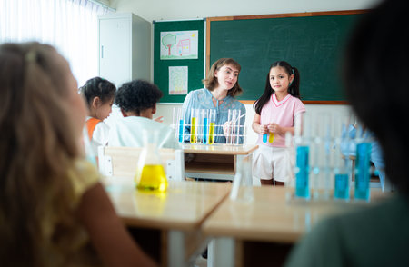 Teacher and students, Learn and experiment with science in a school science classroom.