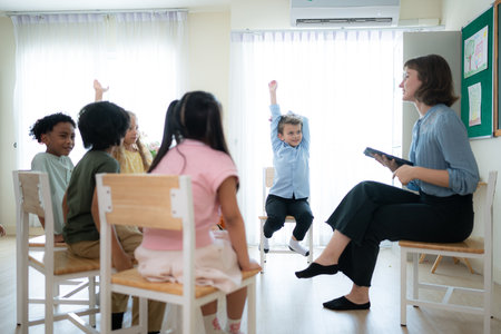 Teacher and students, Learn and study in a classroom of school where youngsters sit and listen attentively.の写真素材