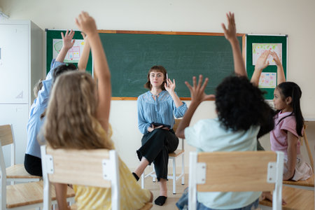 Teacher and students, Learn and study in a classroom of school where youngsters sit and listen attentively.の写真素材