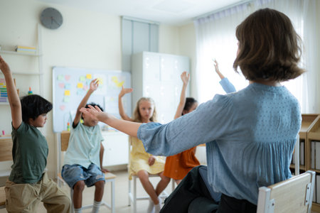 Teacher and students, Learn and study in a classroom of school where youngsters sit and listen attentively.の写真素材