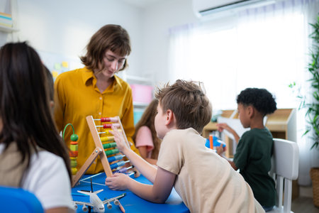 Teacher and students, Learn and study in a classroom of school where youngsters sit and listen attentively.の写真素材