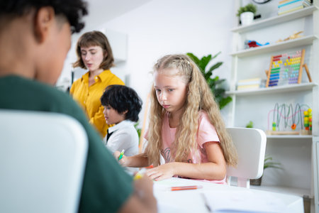 Teacher and students, Learn and study in a classroom of school where youngsters sit and listen attentively.の写真素材
