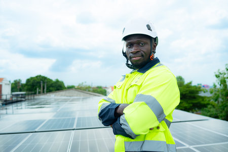 Portrait of technician inspects solar panel installation and test the operation of the panelの写真素材