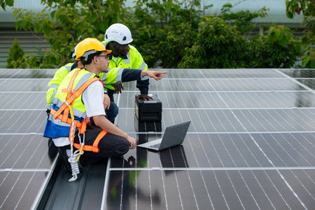 Group of engineer and technician inspects solar panel installation and test the operation of the panelの写真素材