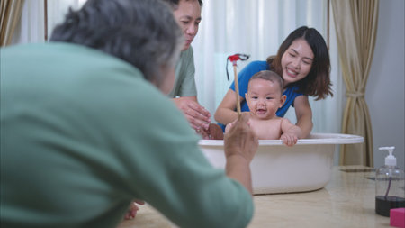 Parents bathe little child after ate meal with grandmother