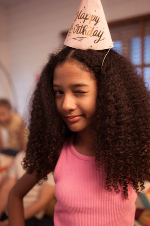 Portrait of teenage girl enjoying the birthday anniversary partyの写真素材