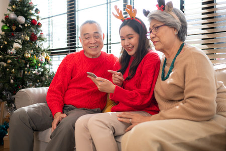 A joyful moment for a large family celebrating together at home during the Christmas seasonの写真素材