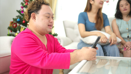 On their day off, A grandfather with grandchild relax and talking together in living room of homeの写真素材
