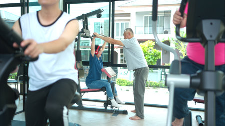 A family with an autistic child exercises together at the village clubhouse during the holidaysの写真素材