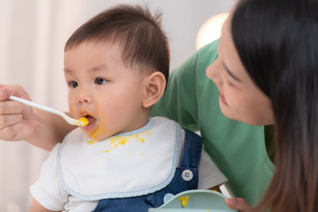 Mom and baby's breakfast timeの写真素材