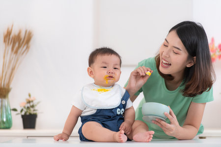 Mom and baby's breakfast timeの写真素材