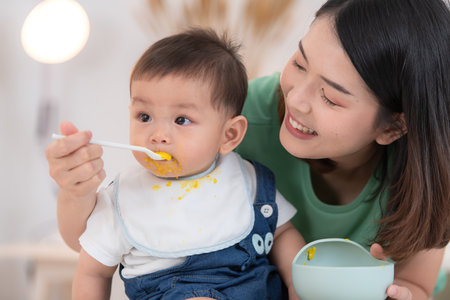 Mom and baby's breakfast timeの写真素材