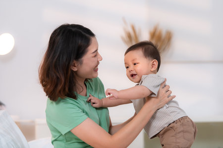 A moment of love between mother and child before going to bedの写真素材