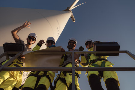The engineering and technical team is preparing to install a large wind turbine to convert wind energy into electricityの写真素材
