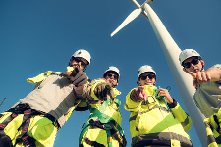 The engineering and technical team is preparing to install a large wind turbine to convert wind energy into electricityの写真素材