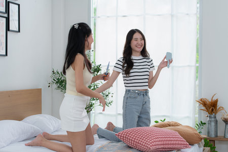 Asian young women conducting their weekly holiday routines from getting upの写真素材