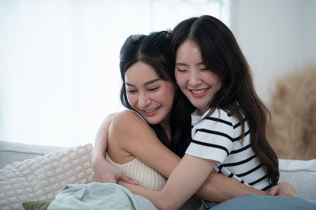 LGBT couples and their holiday activities at homeの写真素材