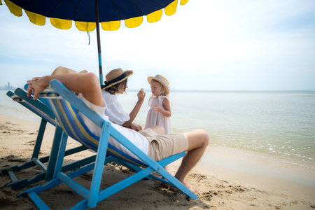 A family relaxing on the beachの写真素材
