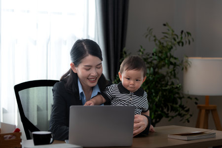 A business mother and his duty to take care of his children while workingの写真素材