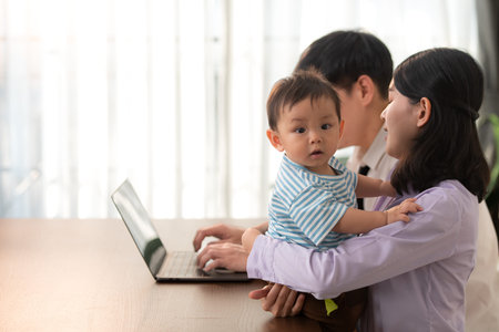 Parents and son play together after dad comes home from work