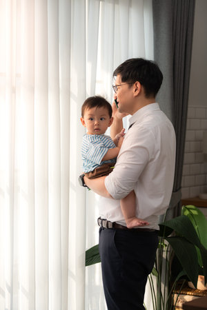A business father take care children while working