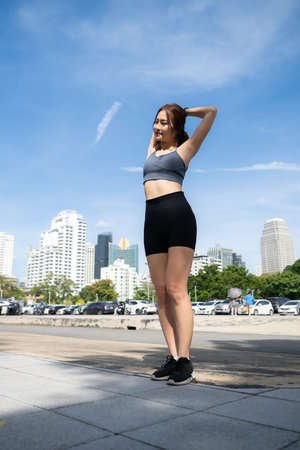 Young woman and exercise time in a city park