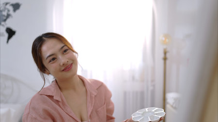 Asian young woman enjoying the happiness of painting