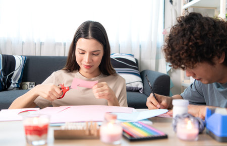 A young couple with Valentine's Day activities at homeの写真素材