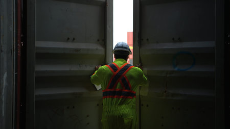 Engineers and technicians inspect the inside of containers and order repairs at the container...