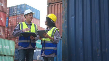 Engineers and technicians inspect the standards of containers that are made and repaired at the container manufacturing and storage facilityの写真素材
