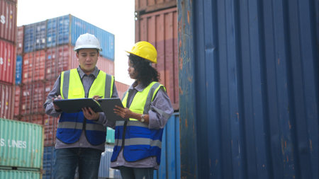 Engineers and technicians inspect the standards of containers that are made and repaired at the container manufacturing and storage facilityの写真素材