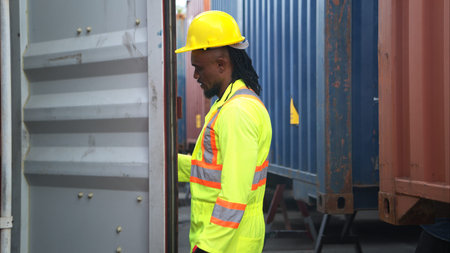 Technicians inspect container repairs by welding at container manufacturing and storage facility