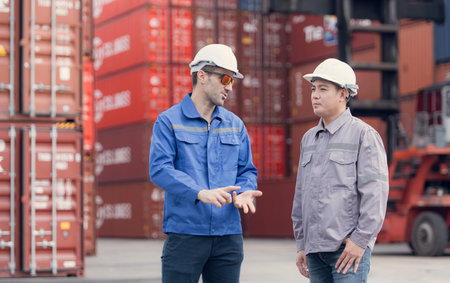Engineers and technicians supervise and inspect the delivery of containers at container...