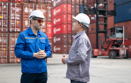 Engineers and technicians supervise and inspect the delivery of containers at container...