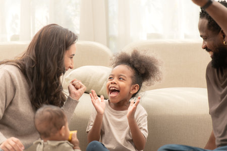 Parents and children relax during their holiday at homeの写真素材