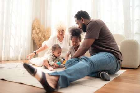 Parents and children relax during their holiday at homeの写真素材