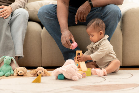Parents and children relax during their holiday at homeの写真素材