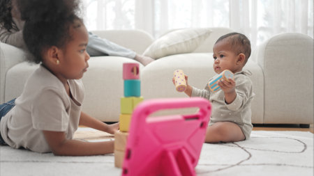 Parents and children relax during their holiday at homeの写真素材