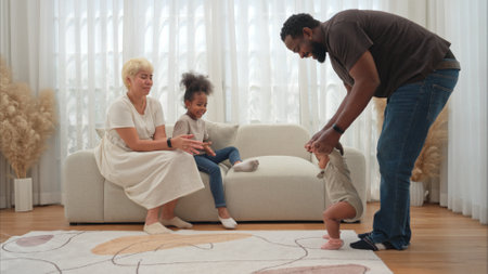 Parents and children relax during their holiday at homeの写真素材