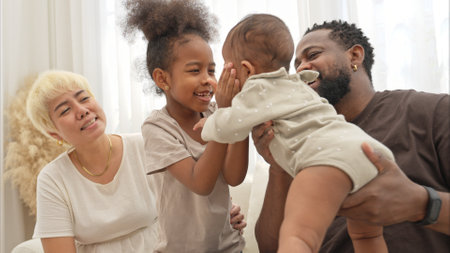 Parents and children relax during their holiday at homeの写真素材