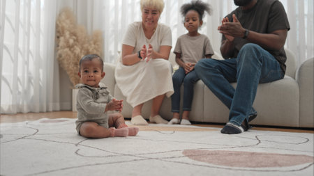 Parents and children relax during their holiday at homeの写真素材