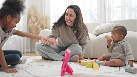 Parents and children relax during their holiday at home