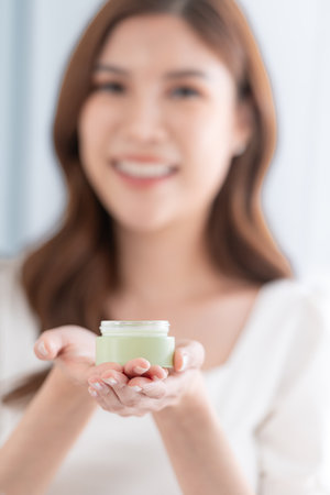 Asian young women and skin care with skin care creamの写真素材